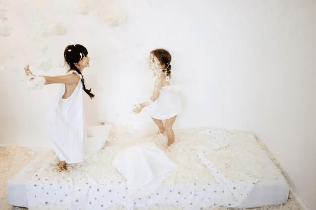 kids playing on mattress